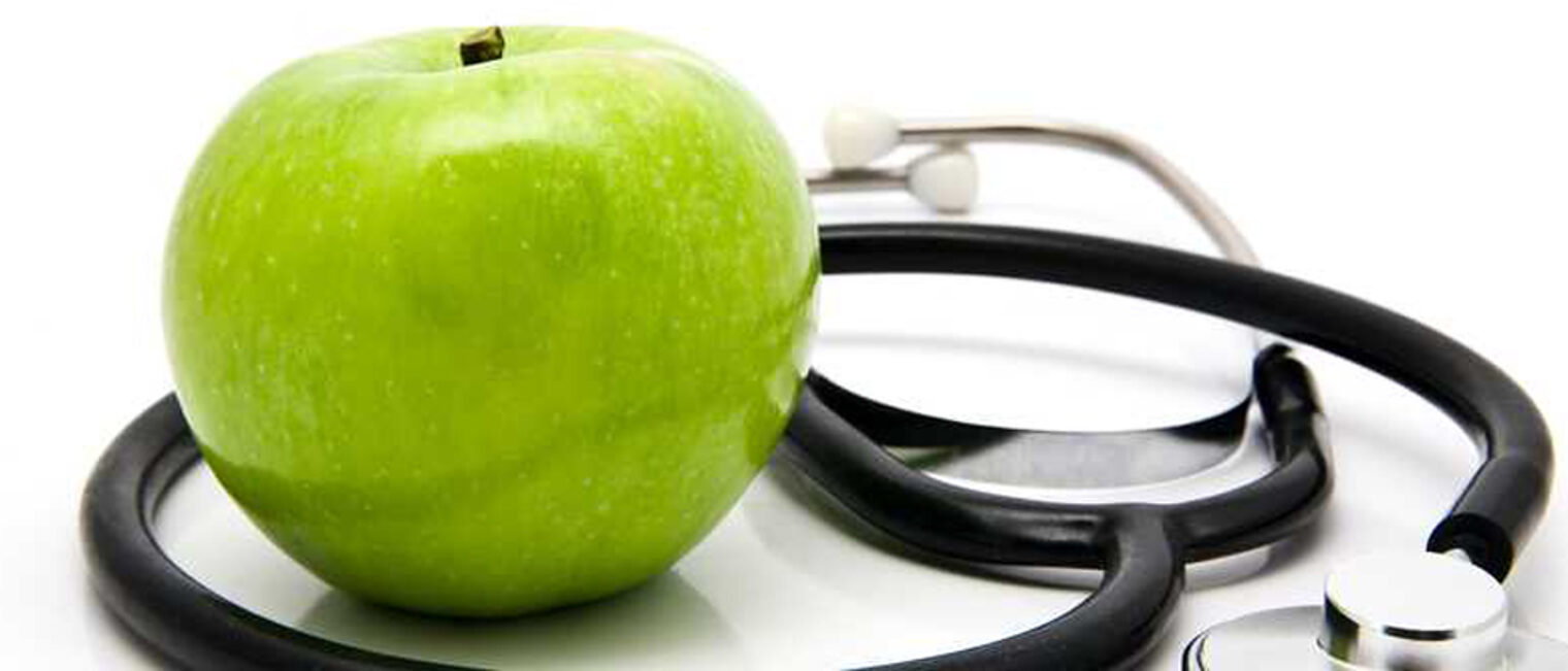 Apfel und Stethoskop