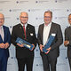 Portrait: Redner Dr. Frost und Dr. Reichert mit Werner Rottler und Raimund Kegel auf der Sachverständigentagung 2024.